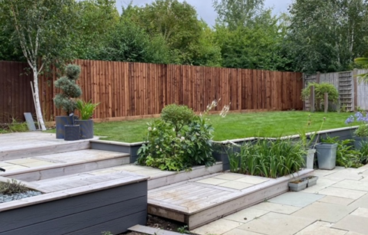 Beautiful garden space with wooden fencing panels